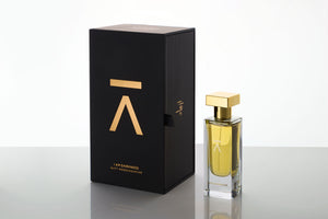 Studio photograph of 'I am darkness' perfume bottle and box by Azman Perfumes in collaboration with Siam Perfume’s perfumer Nutt Wesshasartar, against a white background. The perfume features a dark, mysterious aesthetic with elements of fur, coffee, and rare Cambodian oud