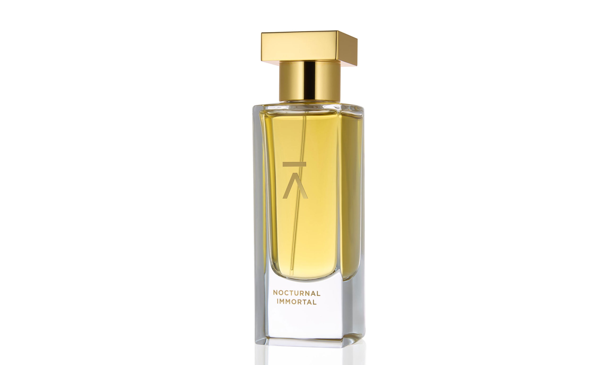 Studio photograph of the ‘Nocturnal Immortal’ perfume bottle by Azman Perfumes, created in collaboration with Julien Rasquinet. Set against a white background, the bottle reflects a woody, oriental, and mysterious aesthetic. The perfume features key notes of Fir Balsam Absolute, Orange Bitter Oil, Cistus Labdanum, Vetiver Oil Haiti, and Hay Absolute, embodying a rich and natural essence.