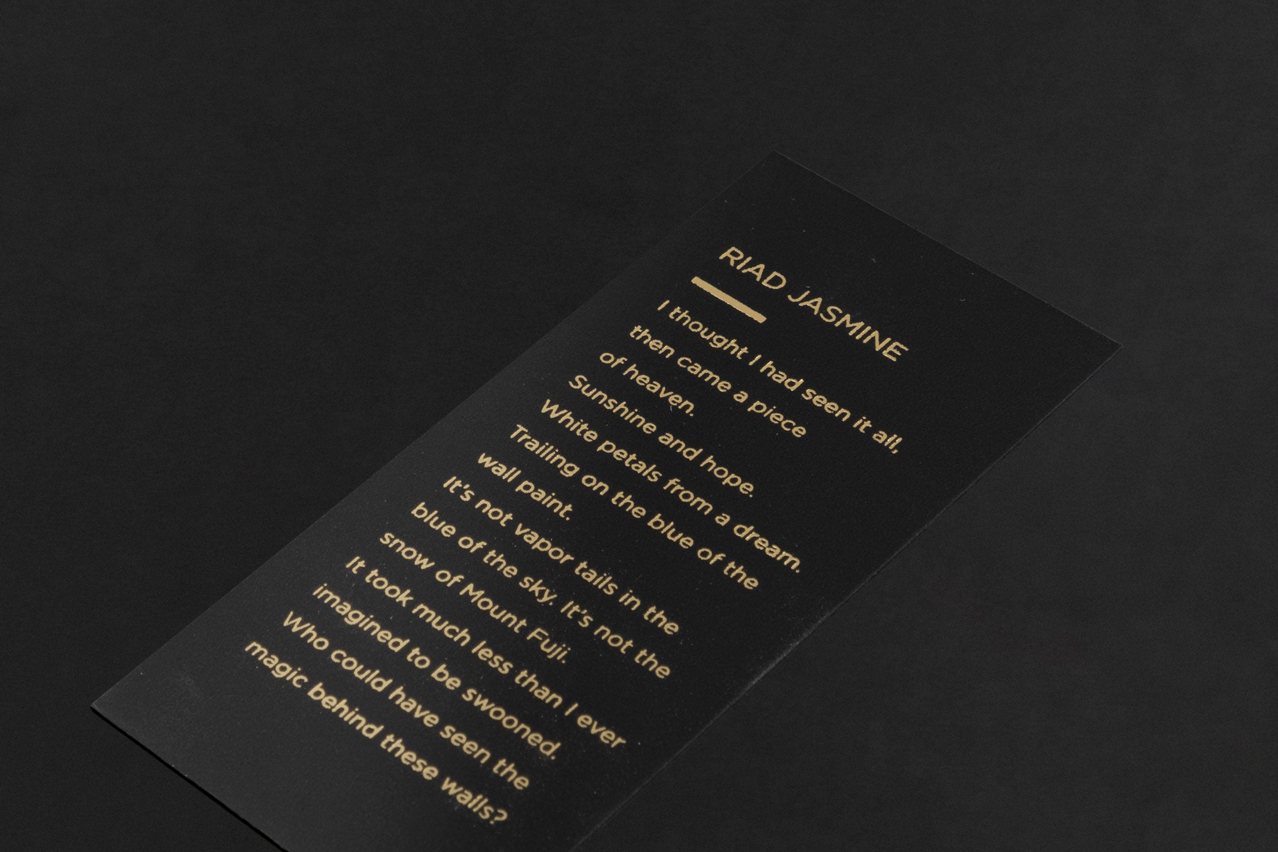 Studio photograph of a ‘Naked Forest’ perfume bottle by Azman Perfumes in collaboration with Prin Lomros, set against a white background. The bottle reflects a green, veggie, and mysterious aesthetic, highlighting elements such as iris, sandalwood, and mango.