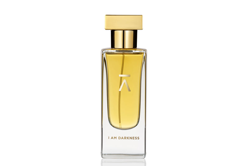 Studio photograph of 'I am darkness' perfume bottle by Azman Perfumes in collaboration with Siam Perfume’s perfumer Nutt Wesshasartar, against a white background. The perfume features a dark, mysterious aesthetic with elements of fur, coffee, and rare Cambodian oud