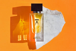Azman perfumes has launched Where we used to live perfumes in collaboration with famous perfumer/nose Euan McCall He is famous for his own Jorum Studio fragrances as well as for senyoko and neandertal perfumes. Where we used to live is made of honeysuckle, magnolia, black current buds, vanilla, rose, saffron, oud from assam etc. Where we used to live deluxe bottle in orange background and placed on piece of marble  studio photography..